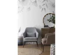 Cadeirão estofado em cor taupe com almofada e pernas em metal preto